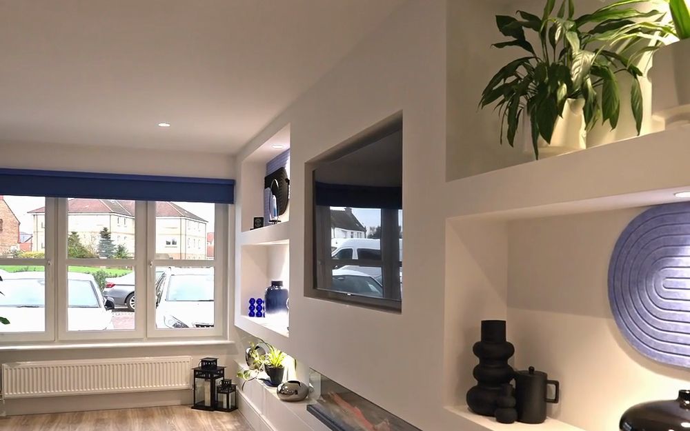 Finished garage conversion by CYC Garage Conversions, living space with built-in shelving